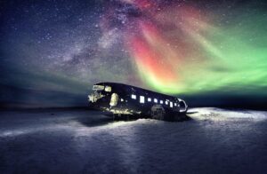 Aurora Borealis magic above Sólheimasandur Plane Wreck in Retkjavìk Iceland Do you want to come here to see Northern Lights